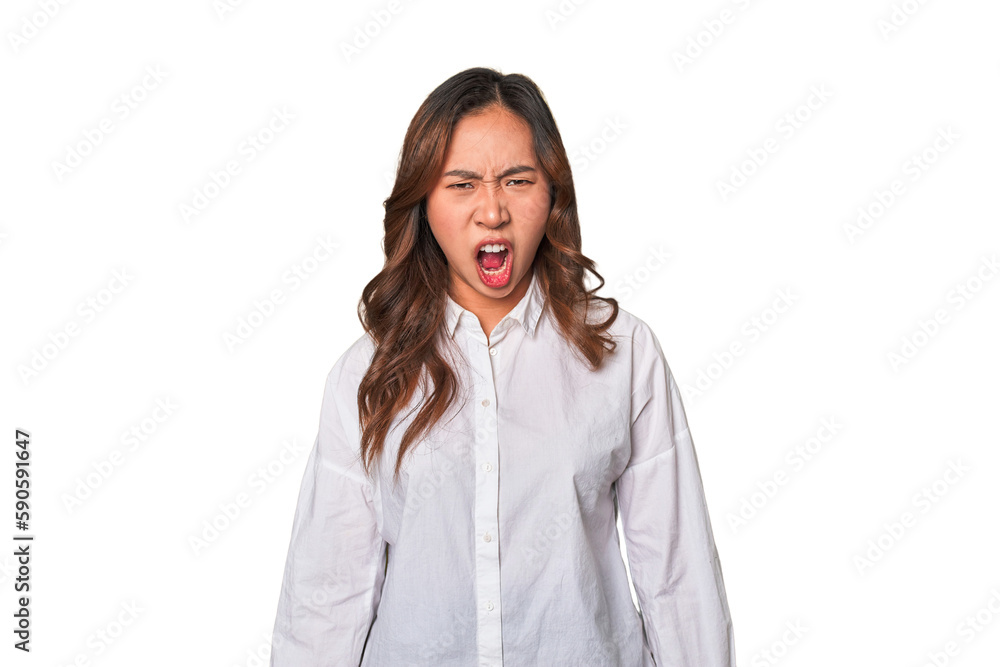 A young chinese woman shouting very angry, rage concept, frustrated. A young chinese woman shouting very angry, rage concept, frustrated.