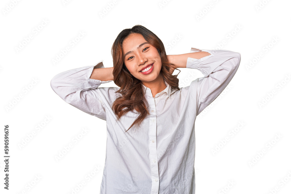 A young chinese woman stretching arms, relaxed position. A young chinese woman stretching arms, relaxed position.