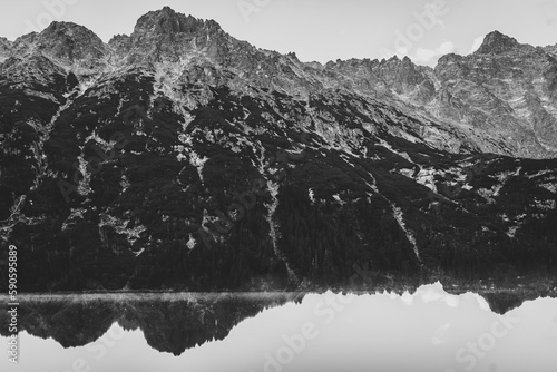Lake in mountains. Black and white photo.