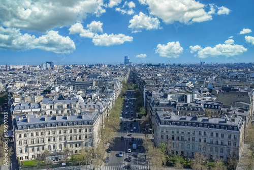 Paris, beautiful Haussmann facades and roofs in a luxury area of the capital, view from the triumph arch, with the new courthouse 