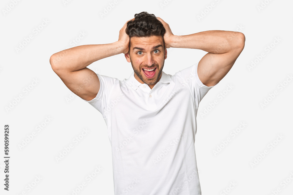 Young handsome man isolated screaming, very excited, passionate, satisfied with something. Young handsome man isolated screaming, very excited, passionate, satisfied with something.
