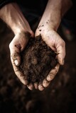 hands collect soil and fertilizer