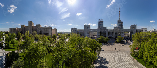 Aerial view on Derzhprom and main Karazin National University buildings on Freedom Square in spring greenery. Kharkiv, Ukraine photo