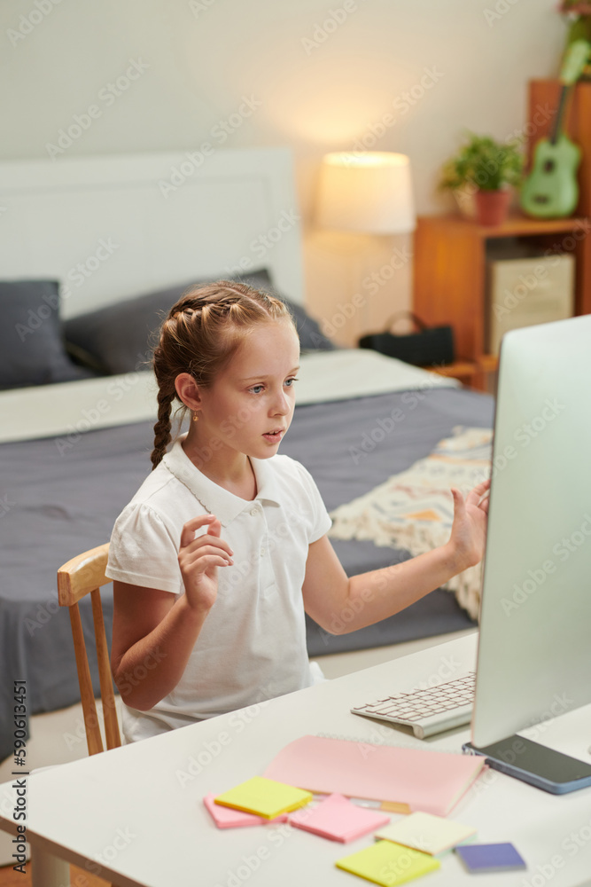 Schoolgirl attending online class, homeschooling concept Schoolgirl attending online class, homeschooling concept