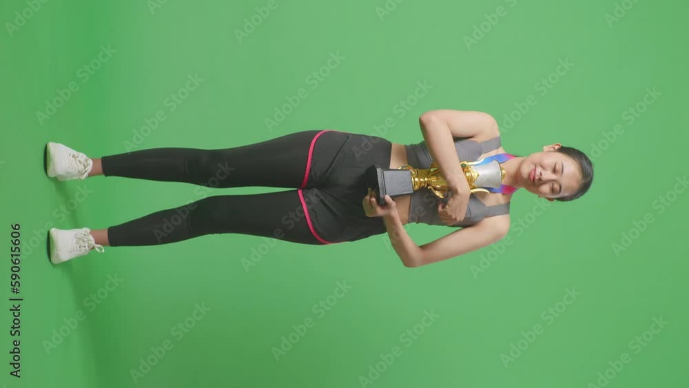 Full Body Of Asian Woman With A Gold Medal Hugging A Gold Trophy Being ...