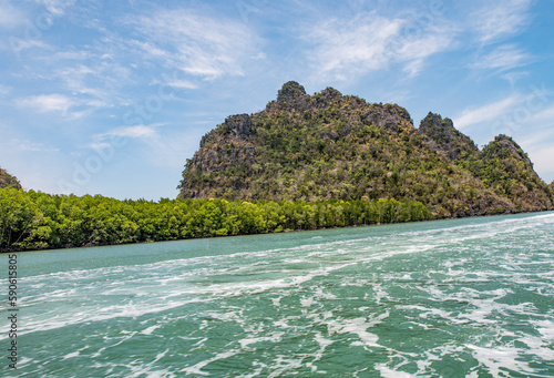 Island in the sea near Langkawi with blue sky and fresh water
