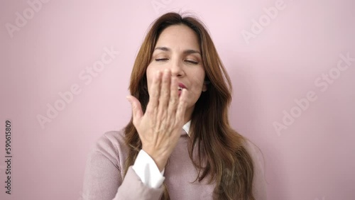 Wallpaper Mural Young beautiful hispanic woman smiling confident doing kiss gesture with hand over isolated pink background Torontodigital.ca