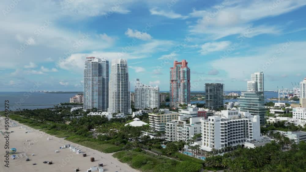 Miami Beach, aerial view of buildings and ocean. Aerial view of Miami South Beach. Miami Beach in Florida with luxury apartments and waterway. Miami Beach, aerial view of buildings and ocean. Aerial view of Miami South Beach. Miami Beach in Florida with luxury apartments and waterway.