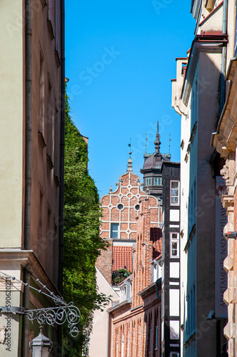Poland, city of Gdansk, Old Town, historic tenement houses with gables. House wall with greenery.