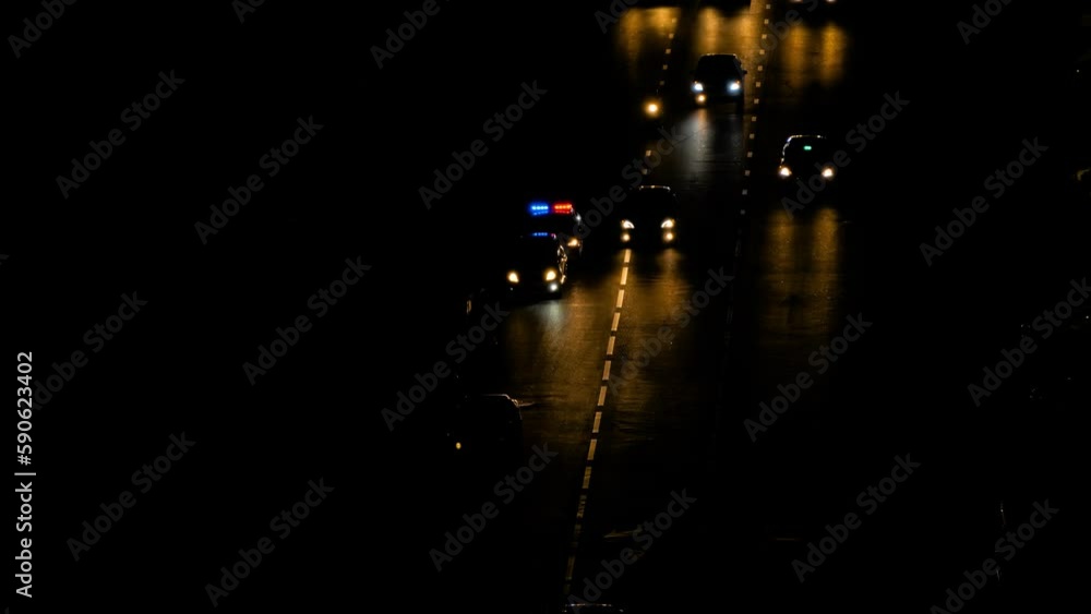High contrast view of dark street, road with moving unrecognizable cars