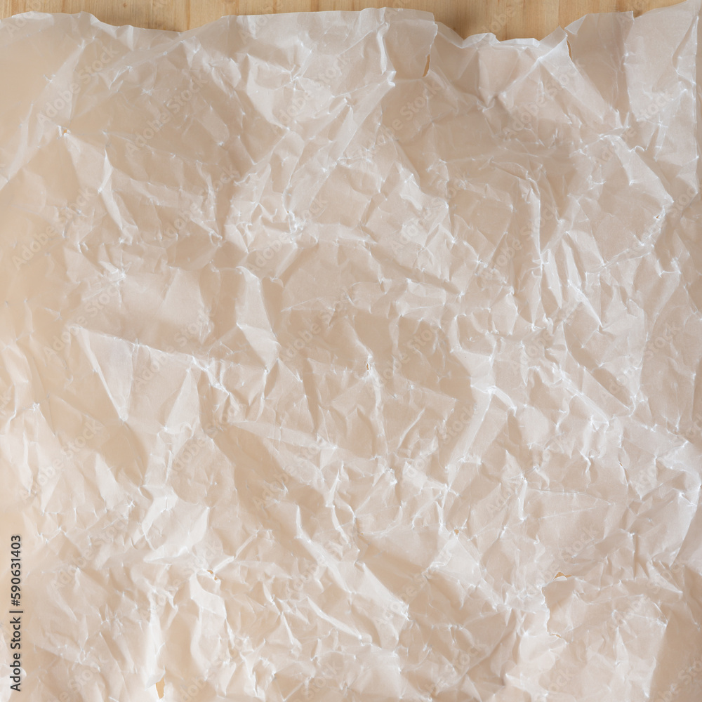 Fototapeta premium crumpled tracing paper texture on wood