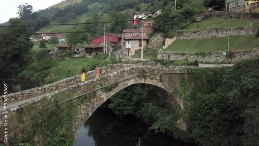 Asturias Senda del Oso, diverse couple trekking travel in nature. Aerial drone scenic view Asturias Senda del Oso, diverse couple trekking travel in nature. Aerial drone scenic view