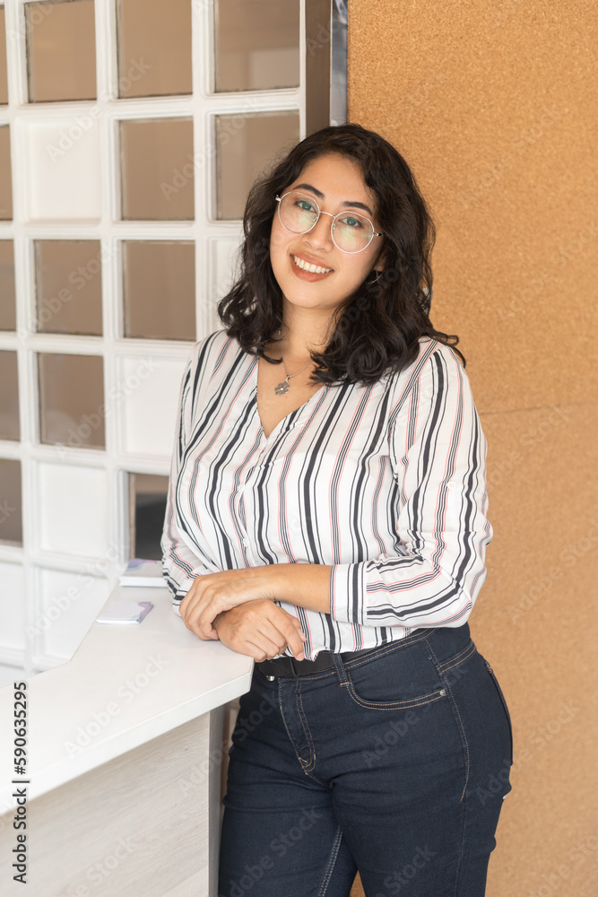 beautiful young latin woman with short wavy hair wears glasses and elegant blouse, beauty and casual fashion, office lifestyle beautiful young latin woman with short wavy hair wears glasses and elegant blouse, beauty and casual fashion, office lifestyle