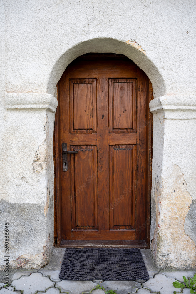 Beautiful brown wooden monastery door.