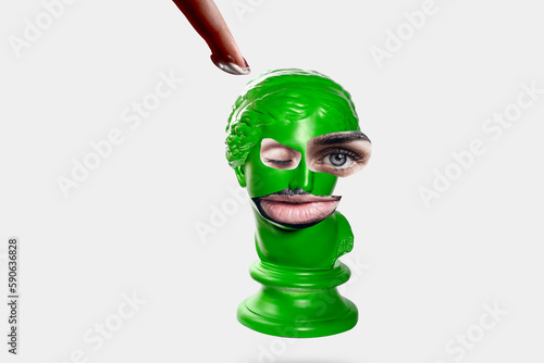 green statue with eyes