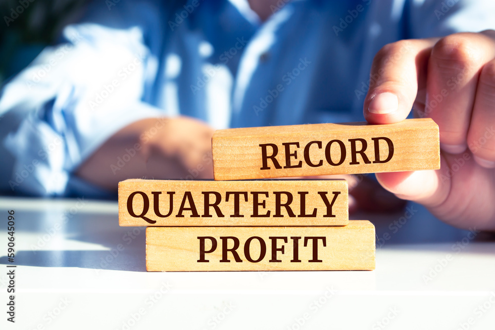 Wooden blocks with words 'Record quarterly profit'. Business concept Wooden blocks with words 'Record quarterly profit'. Business concept
