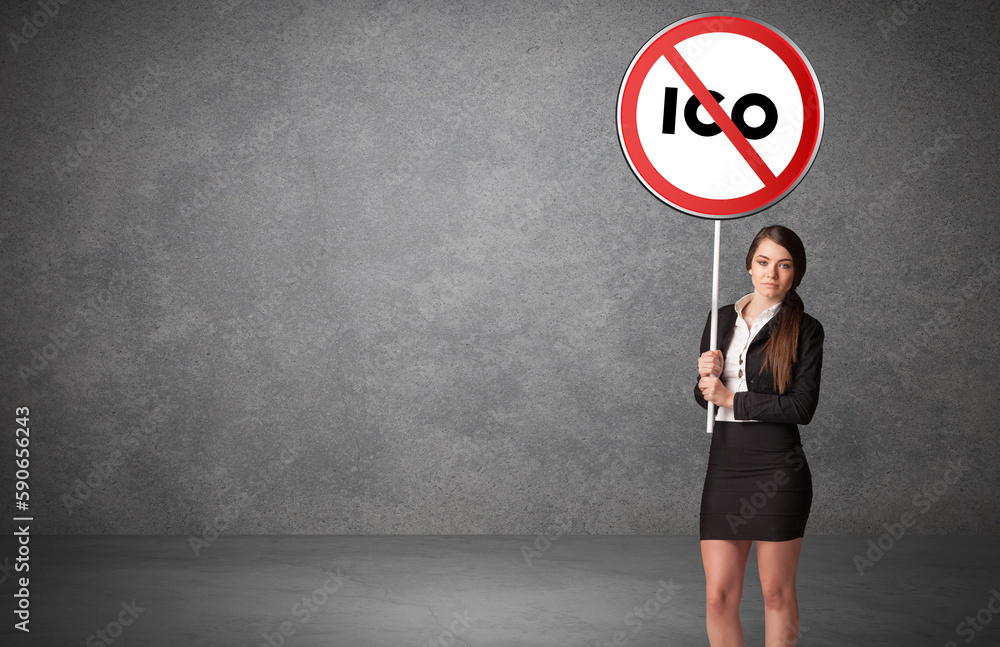 Young business person holdig traffic sign Young business person holdig traffic sign