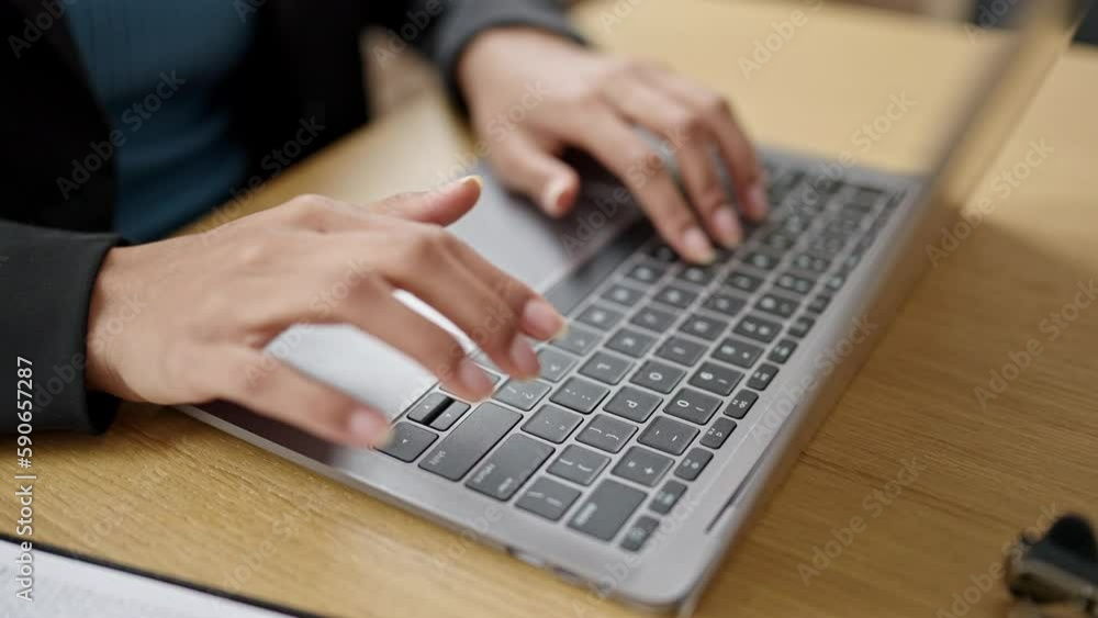 Young beautiful hispanic woman using computer typing on keyboard at office Young beautiful hispanic woman using computer typing on keyboard at office