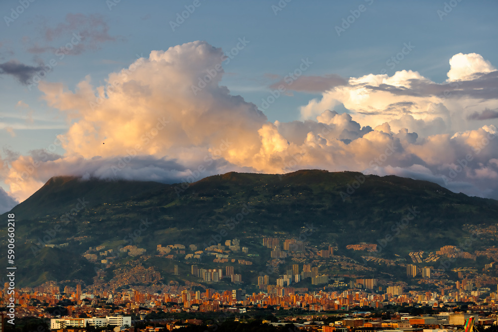 Hill with buildings in Medellin, Colombia, during sunset