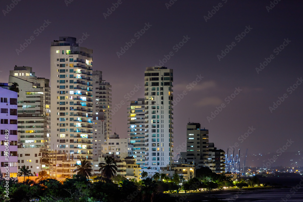 Panoramic night view of buildings with port in the background in Cartagena de Indias, Colombia