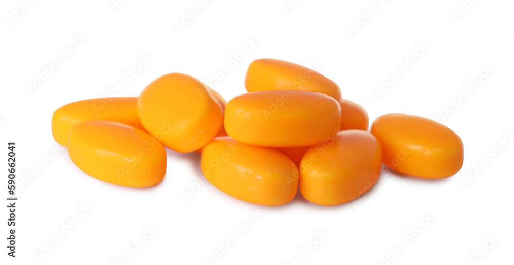 Tasty orange dragee candies on white background Tasty orange dragee candies on white background