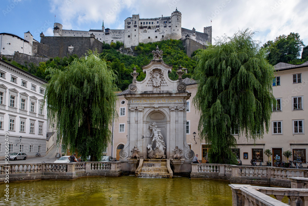 Horse well fountain and Salzburg castle.