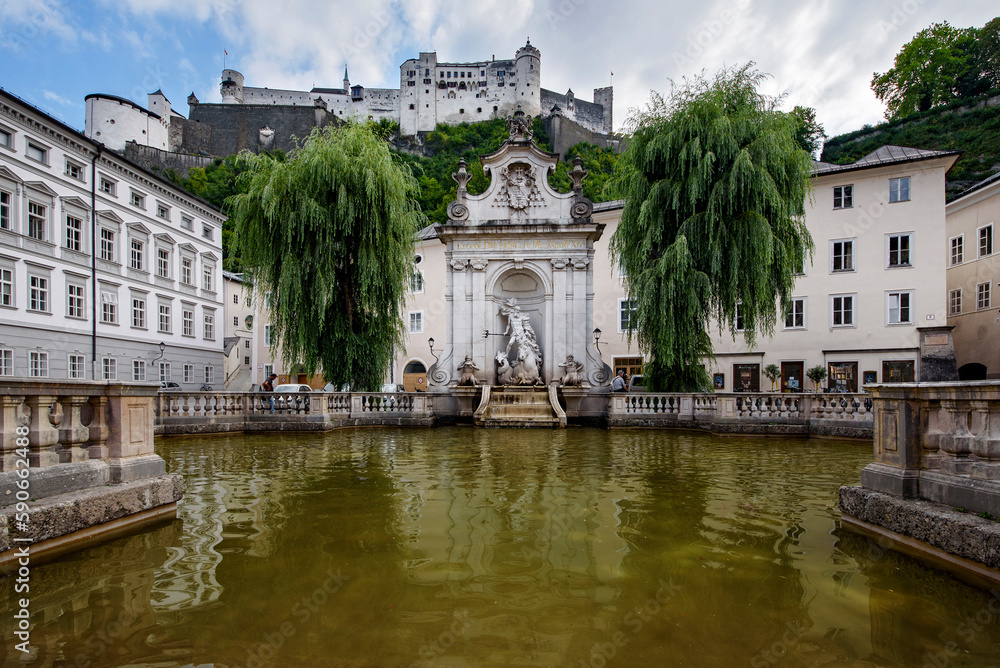 Horse well fountain and Salzburg castle.