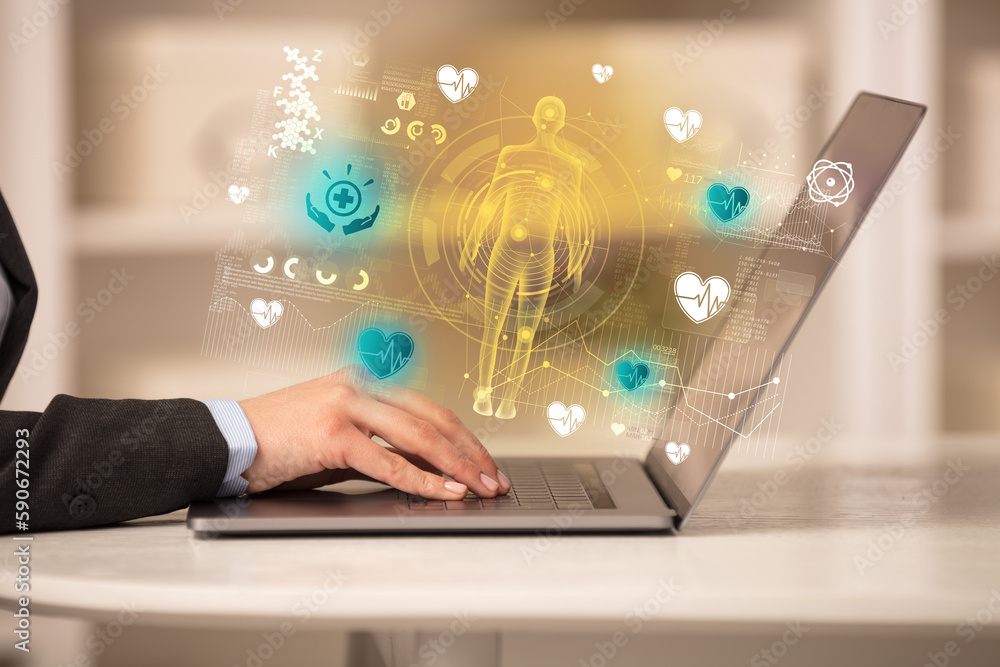 Doctor working on laptop with healthcare concept Doctor working on laptop with healthcare concept