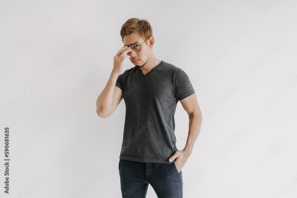 Cool and serious colored hair Asian man in black t-shirt isolated on white. Cool and serious colored hair Asian man in black t-shirt isolated on white.