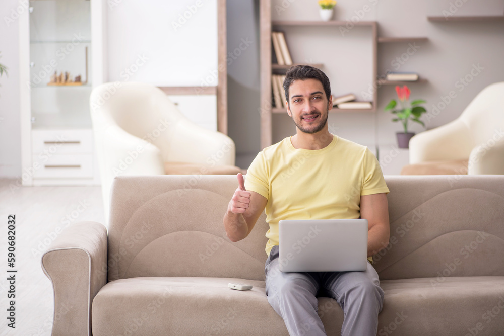 Young man working from home during pandemic Young man working from home during pandemic