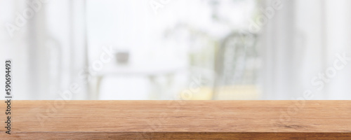 Empty wood table top and blurred bed room of home interior with window room background. - can used for display or montage your products.