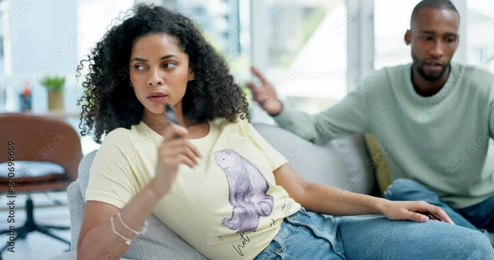 Couple, nicotine and argue about addiction with a woman smoking an e cigarette in the living room of her home. Smoke, habit and lifestyle with an attractive young female smoker in her house to relax Couple, nicotine and argue about addiction with a woman smoking an e cigarette in the living room of her home. Smoke, habit and lifestyle with an attractive young female smoker in her house to relax