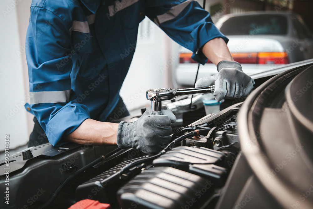 Car care maintenance and servicing, Hand technician auto mechanic using the wrench to fix car or repairing change spare part engine problem and insurance service support the range of car check.