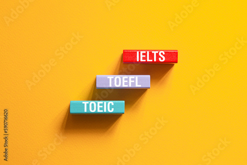 IELTS, TOEFL, TOEIC - word concept on cubes,text