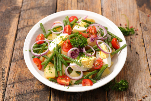 mixed vegetable salad with tomato, egg, bean and potatoes