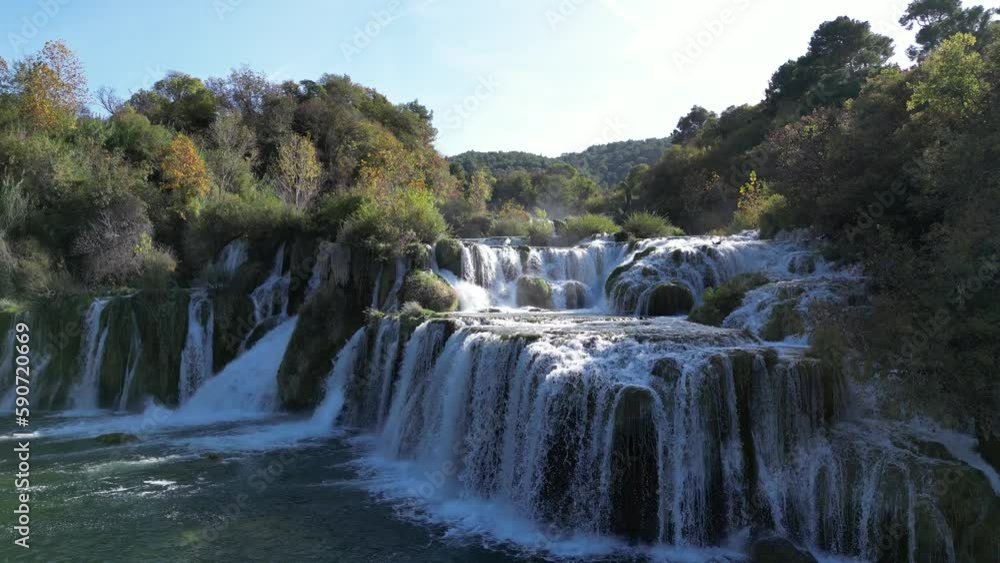 Skradinski buk with its beautiful waterfalls and blue pools in Krka National Park. Drone video of the large series of cascades rising up. Skradinski buk with its beautiful waterfalls and blue pools in Krka National Park. Drone video of the large series of cascades rising up.