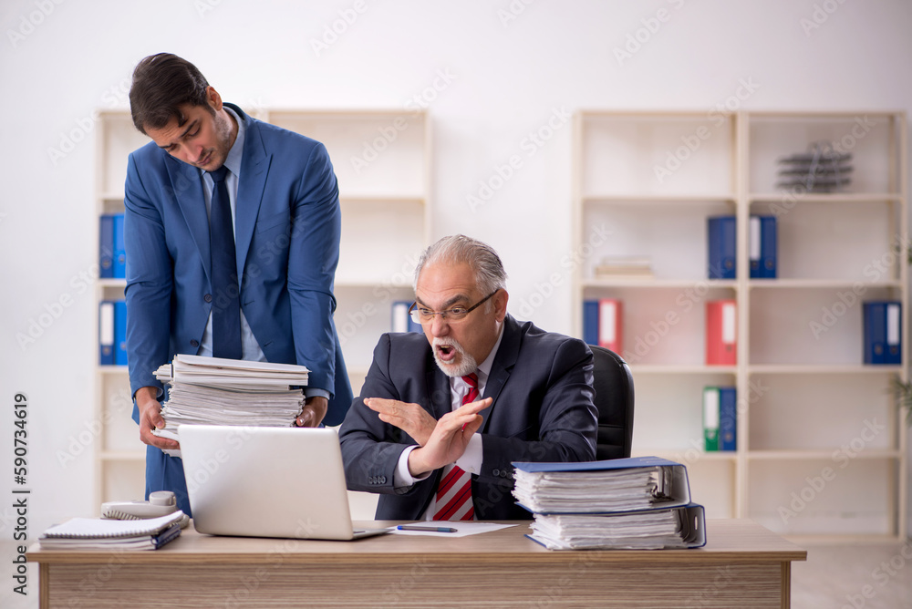 Two male colleagues working in the office Two male colleagues working in the office