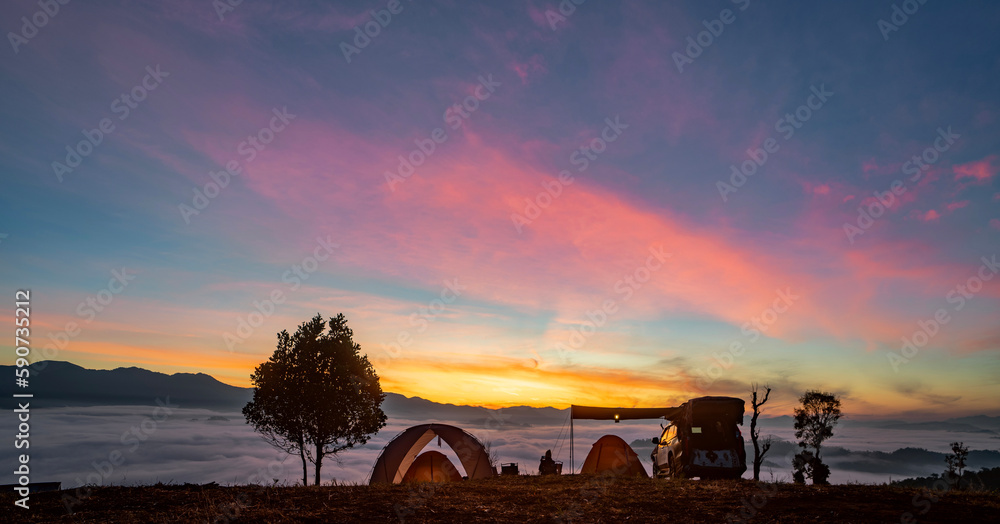 Orange tent in camping area in top of Mea Omgi at Tak, North of Thailand in winter season and balloon Orange tent in camping area in top of Mea Omgi at Tak, North of Thailand in winter season and balloon