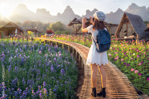 Flower in garden at Phu pha muak with asian woman traveller photo