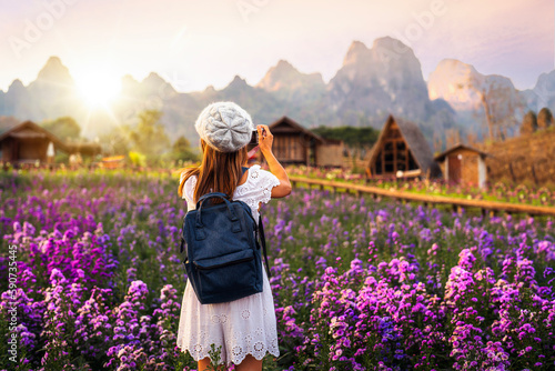 Flower in garden at Phu pha muak with asian woman traveller photo