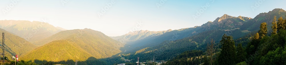 Panorama: Caucasus mountains at sunset in summer