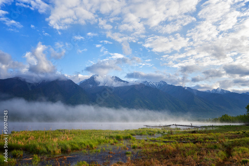 Landscape with mountains  on fog summer day. Buryatia, Tunkinskaya valley photo