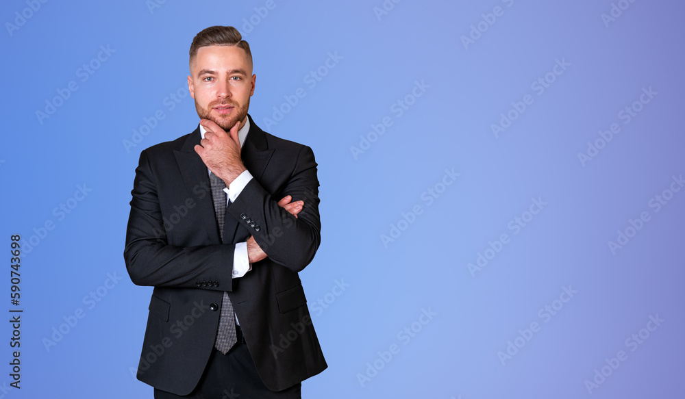 Thoughtful young businessman portrait, blue Thoughtful young businessman portrait, blue