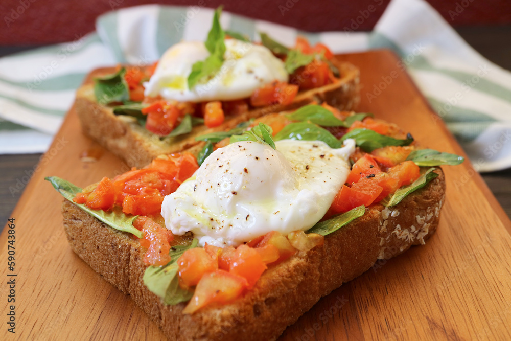 Tasty and Healthy Fresh Tomato and Basil Toast Topped with Poached Egg Tasty and Healthy Fresh Tomato and Basil Toast Topped with Poached Egg