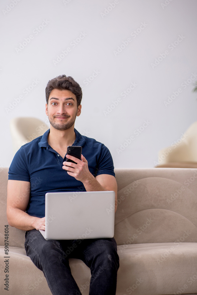 Young male freelancer working from home Young male freelancer working from home