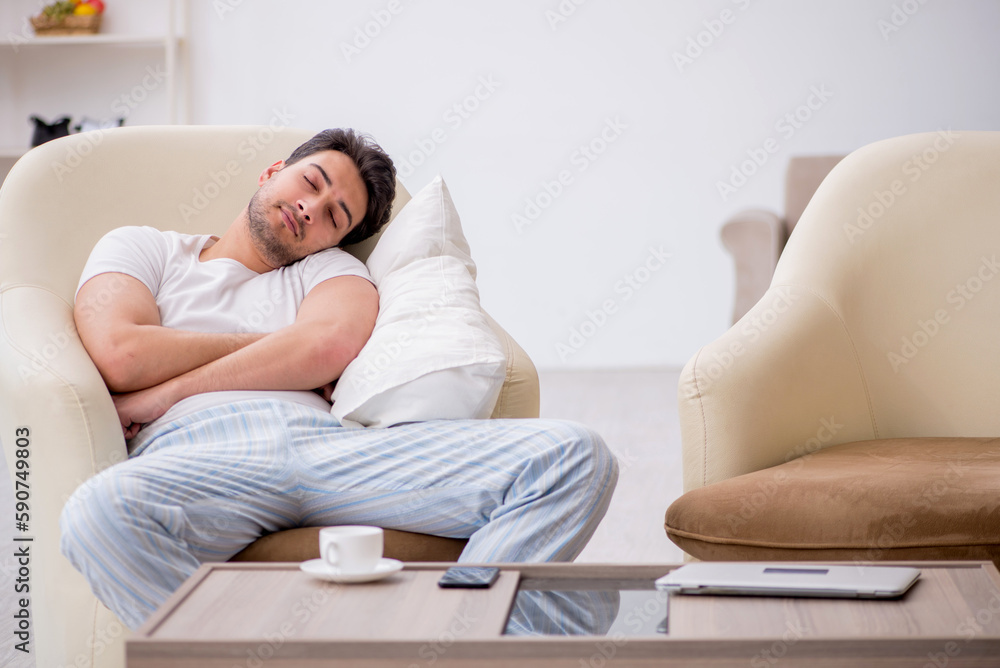 Young man starting day at home