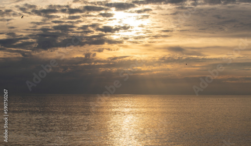 Sunset on the sea, sky with clouds, summer.