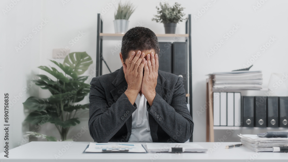 Tired, Elderly Old Senior Asian male businessman wearing formal suit ,confident professional bookkeeper doing bookkeeping, lawyer, stock market trader or broker. Tired, Elderly Old Senior Asian male businessman wearing formal suit ,confident professional bookkeeper doing bookkeeping, lawyer, stock market trader or broker.