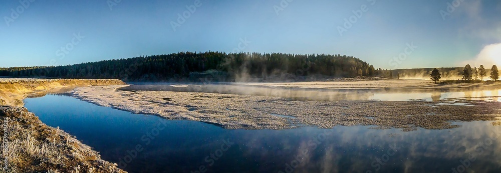 Panoramic shot of a lake on a sunny day in Grand Teton National Park, the United States Panoramic shot of a lake on a sunny day in Grand Teton National Park, the United States