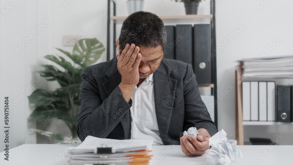 Tired, Elderly Old Senior Asian male businessman wearing formal suit ,confident professional bookkeeper doing bookkeeping, lawyer, stock market trader or broker. Tired, Elderly Old Senior Asian male businessman wearing formal suit ,confident professional bookkeeper doing bookkeeping, lawyer, stock market trader or broker.